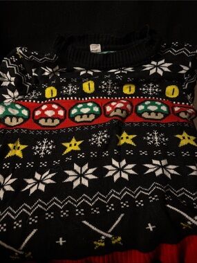 Super Mario Bros. themed ugly Christmas sweater featuring mushroom and star